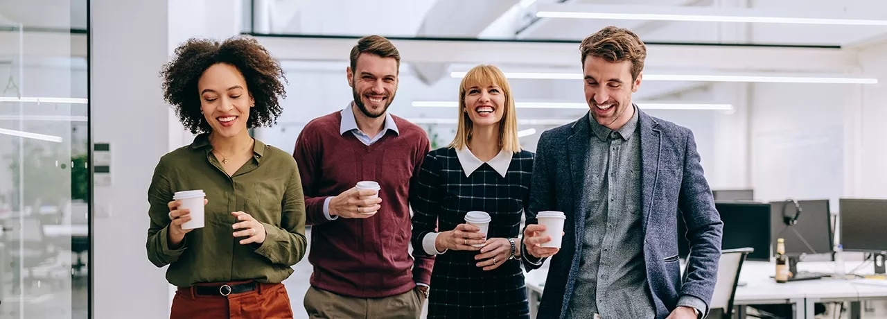group walking with coffee 