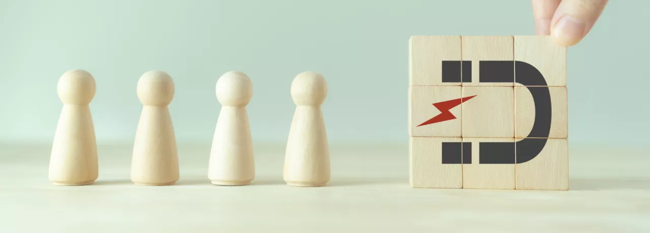 A photo that shows a magnet drawing in figures of people 