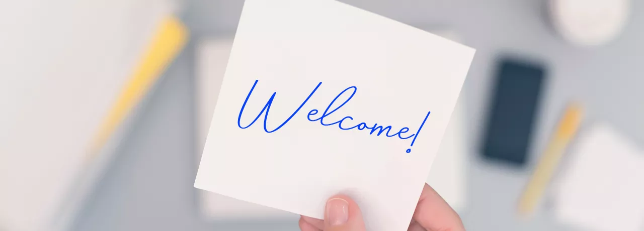An image that shows a sticky note that says "Welcome!" 