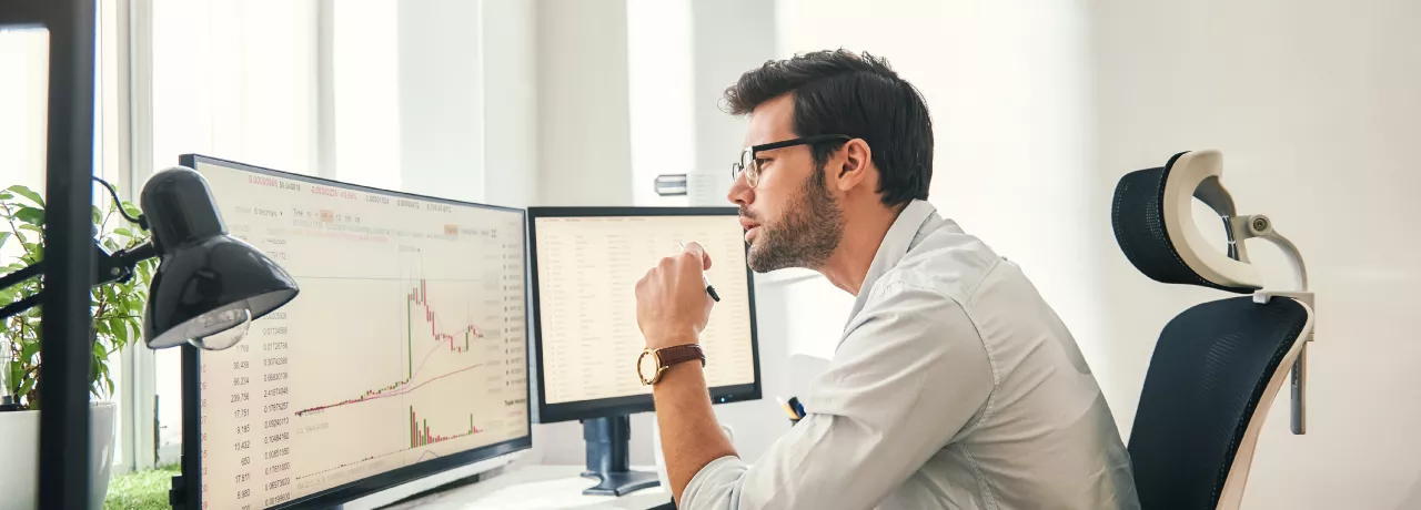 Employee reviewing engagement statistics on computer 