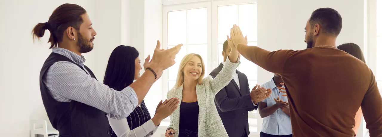 Employees high fiving 