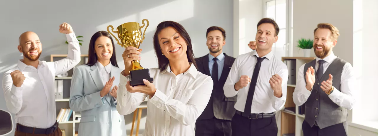 A group of happy employees participating in an employee incentive program that boosts employee morale, employee satisfaction and employee retention 