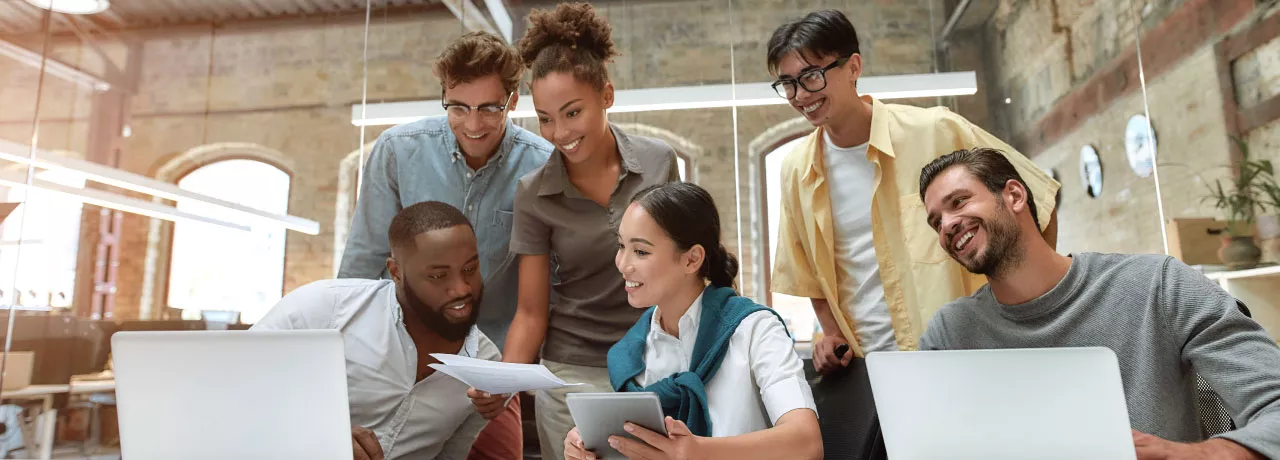 Team collaborating around a table at work 