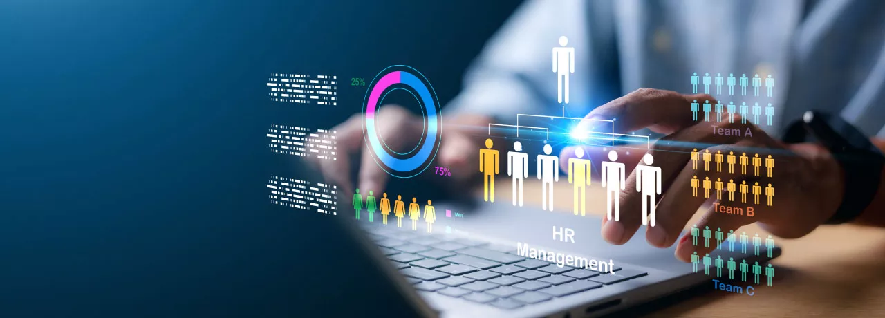 A HR professional on their laptop working on human resources management tasks 