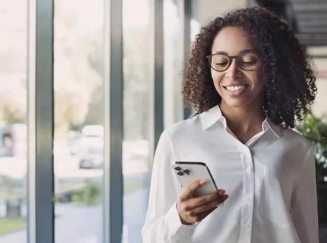 woman looking at mobile phone