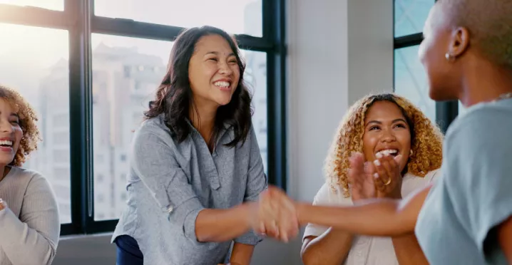 Two coworkers shaking each others hands
