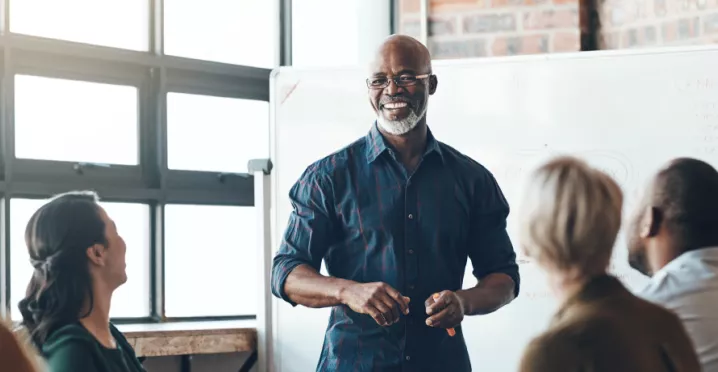 A person giving a presentation in front of their colleagues