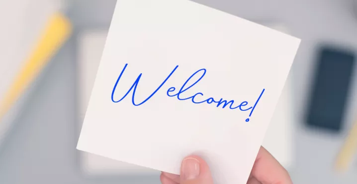 An image that shows a sticky note that says "Welcome!"