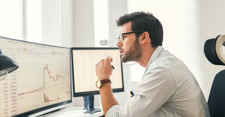 Employee reviewing engagement statistics on computer