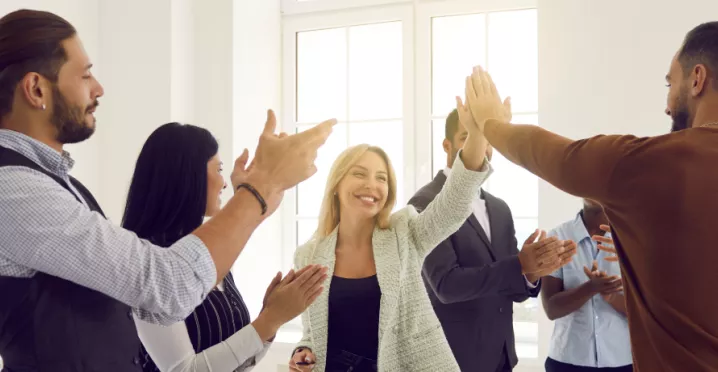 Employees high fiving