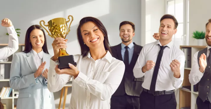 A group of happy employees participating in an employee incentive program that boosts employee morale, employee satisfaction and employee retention