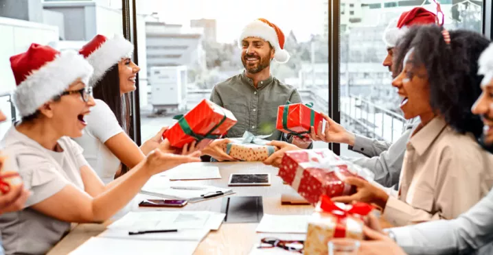 Employees opening their holiday gifts of appreciation