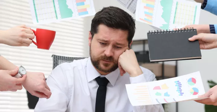 An overwhelmed, disengaged employee trying to manage all on their to-do list.