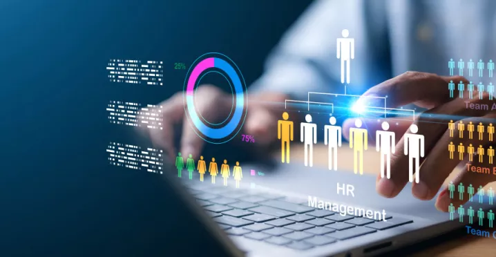 A HR professional on their laptop working on human resources management tasks