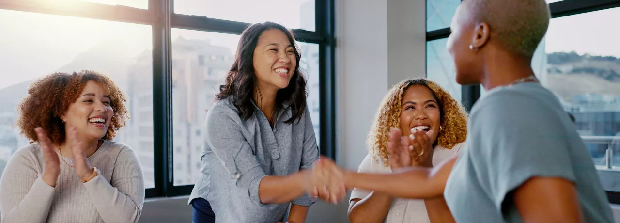 Two coworkers shaking each others hands