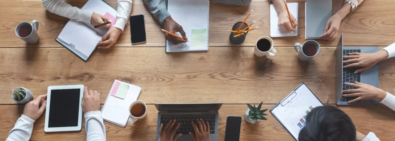 Employees working at a table