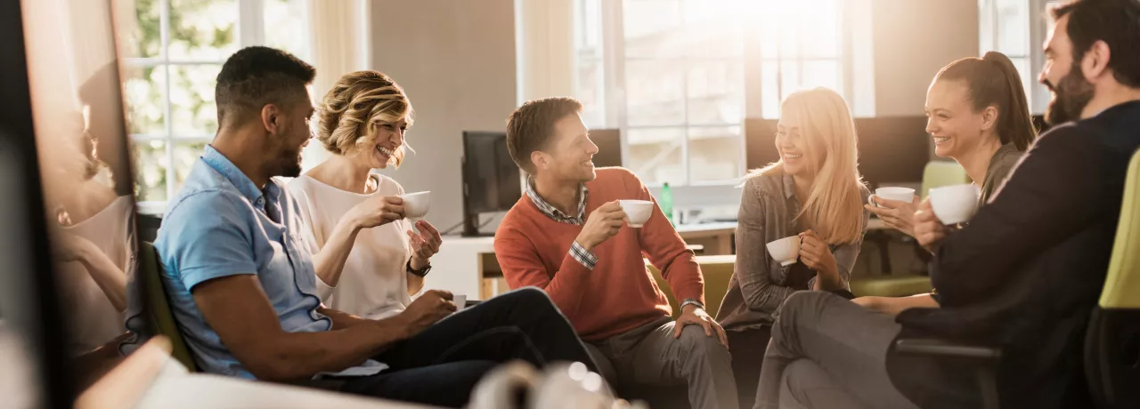 Six colleagues discussing in a conference room