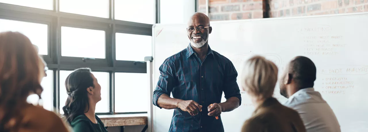 A person giving a presentation in front of their colleagues