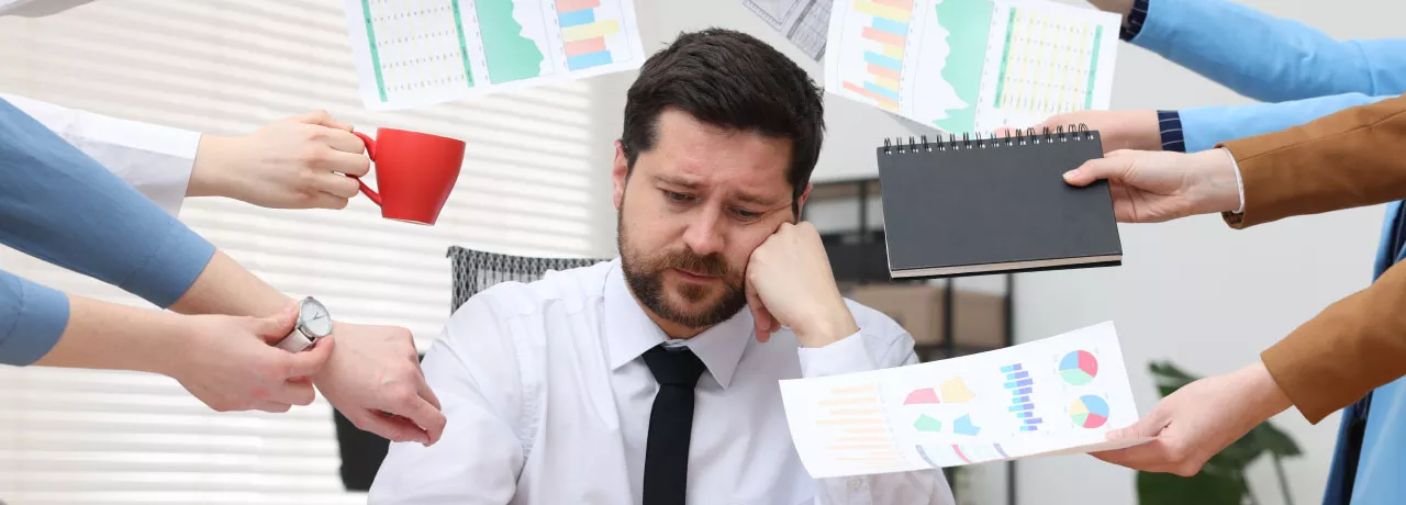 An overwhelmed, disengaged employee trying to manage all on their to-do list.