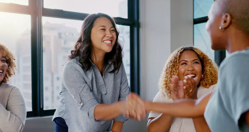 Two coworkers shaking each others hands