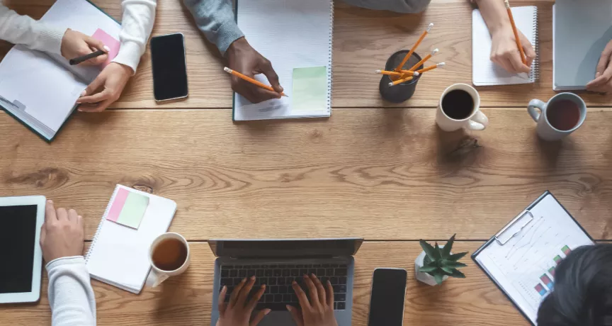 Employees working at a table