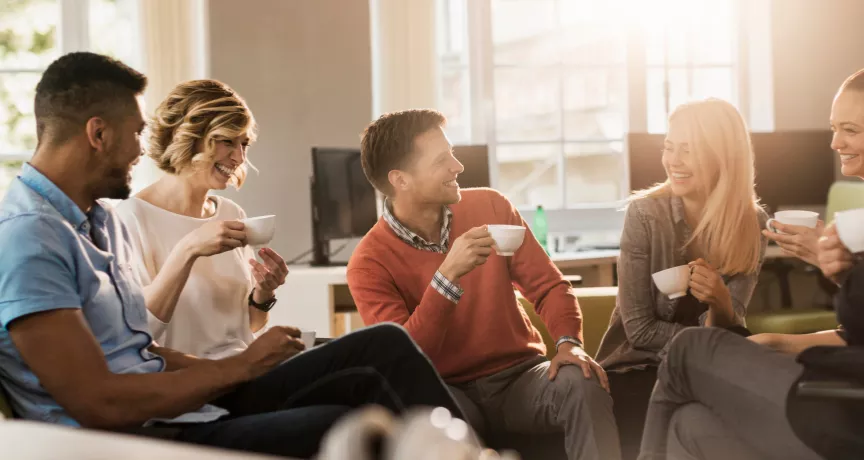 Six colleagues discussing in a conference room