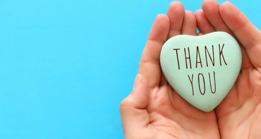 Image shows two hands cupped together with a heart in the middle that says "Thank You"