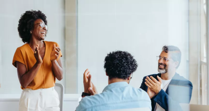 Team celebrating around a table
