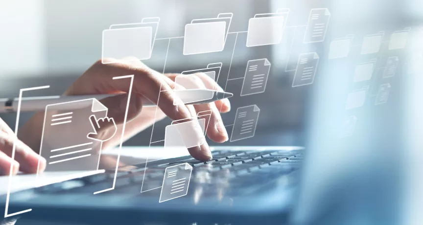 Hands typing on a computer with transparent icons hovering in front