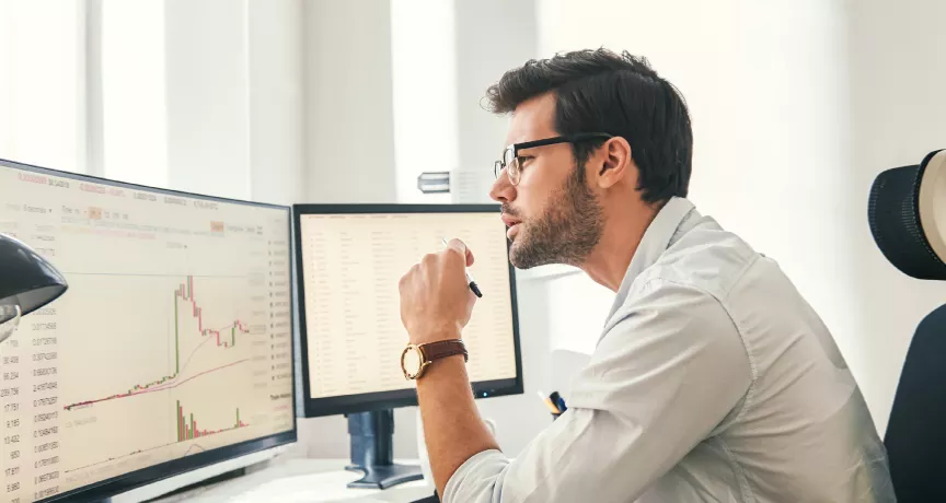 Employee reviewing engagement statistics on computer