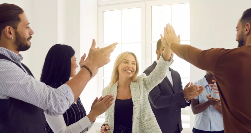 Employees high fiving