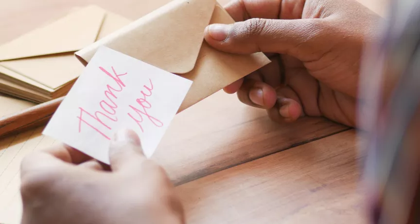 Customer service professional receiving thank you message for Customer Service Week