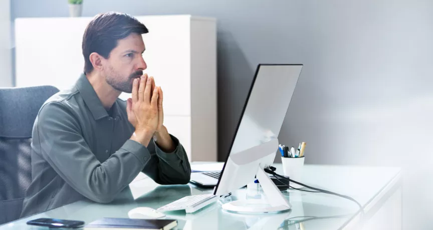 An upset employee sitting at their desk