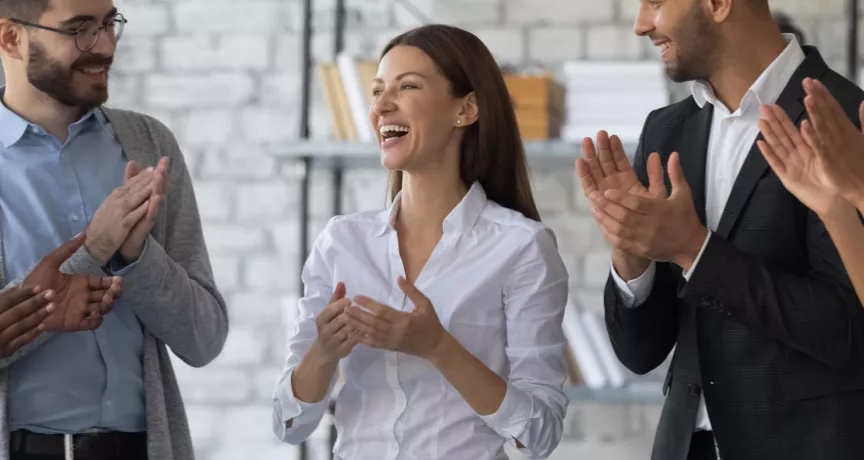 Employee being recognized by their team