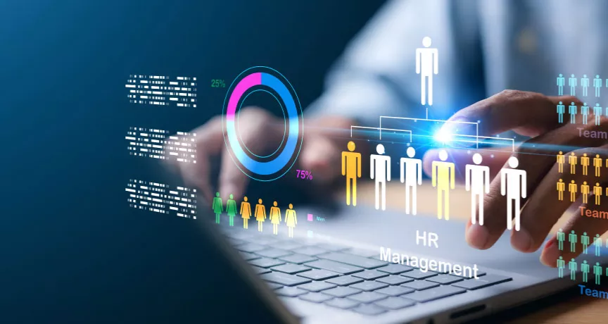 A HR professional on their laptop working on human resources management tasks