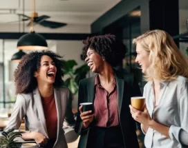 Three employees laughing together