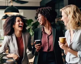 women laughing in office