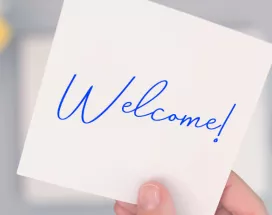 An image that shows a sticky note that says "Welcome!"