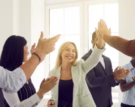 Employees high fiving