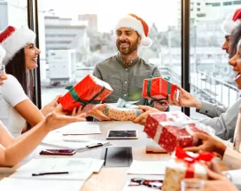 Employees opening their holiday gifts of appreciation