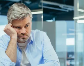 Sad worker disengaged at work due to a toxic work culture