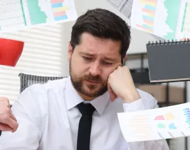 An overwhelmed, disengaged employee trying to manage all on their to-do list.