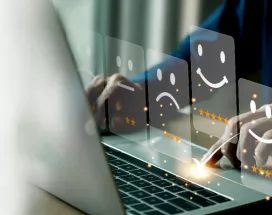 Employee sharing their thoughts and feelings in a HR survey on their laptop
