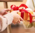 People giving each other a holiday gift