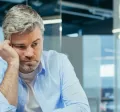 Sad worker disengaged at work due to a toxic work culture