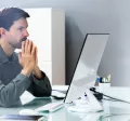 An upset employee sitting at their desk