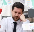 An overwhelmed, disengaged employee trying to manage all on their to-do list.