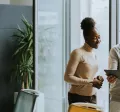 A group of employees working collaboratively together on an tablet.