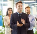 A group of employees celebrating with one another in the office