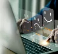 Employee sharing their thoughts and feelings in a HR survey on their laptop